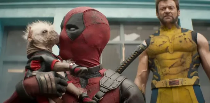 Deadpool kisses small dog, Wolverine disgusted